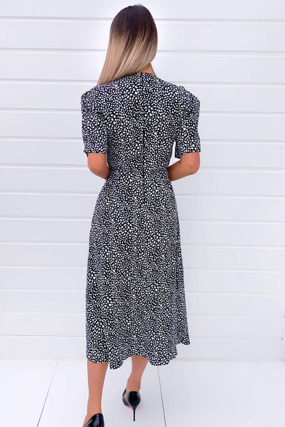 Chic Black Midi Dress with Unique Print and Stylish Split Hem
